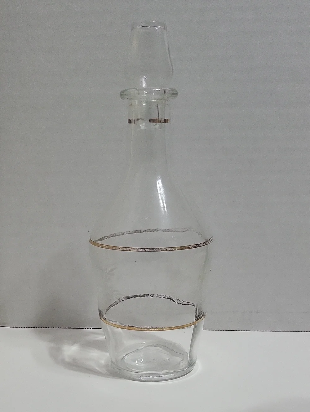 Clear Glass Decanter with Gold Accent and Leaf Etching.
